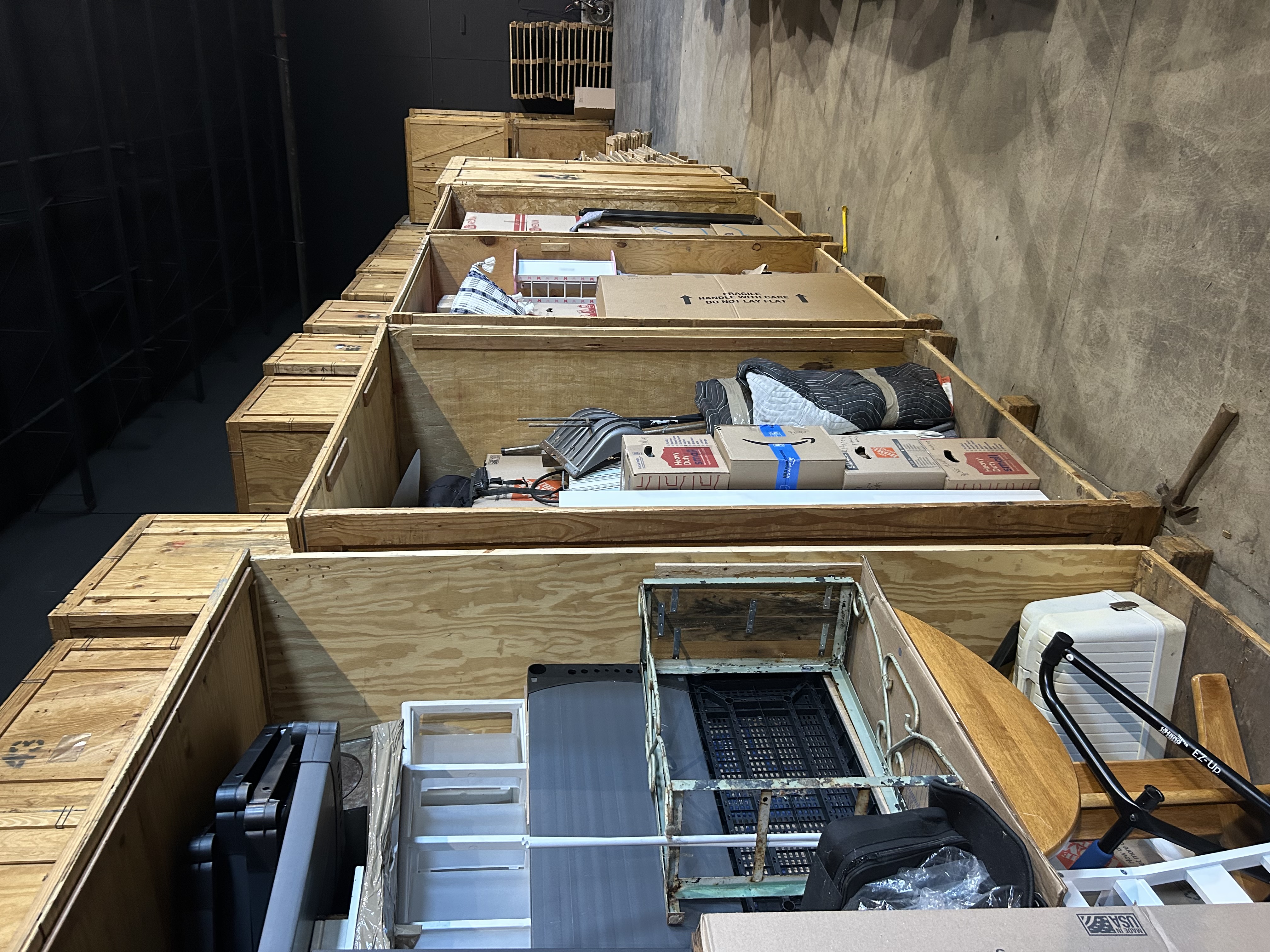 Mantis Moving crew placing wrapped furniture into storage unit Royal Oak MI